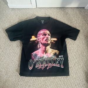 UFC Sean O'Malley Suga Black T-Shirt Licensed MMA
width:29”
Length:26”